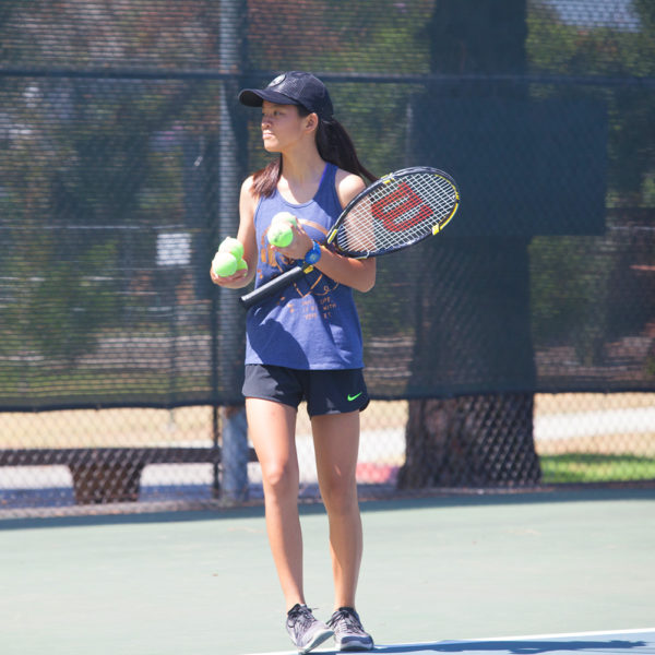 Junior Teen tennis player on court