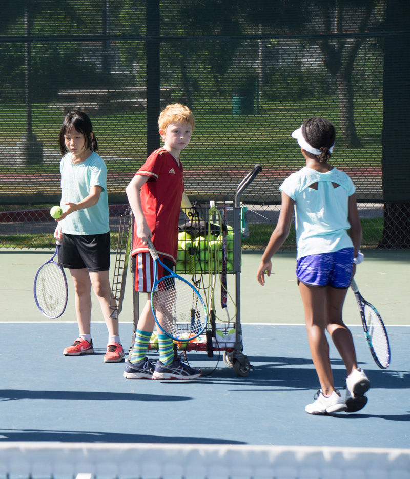 Kids learning tennis on courts Badon Tennis Academy